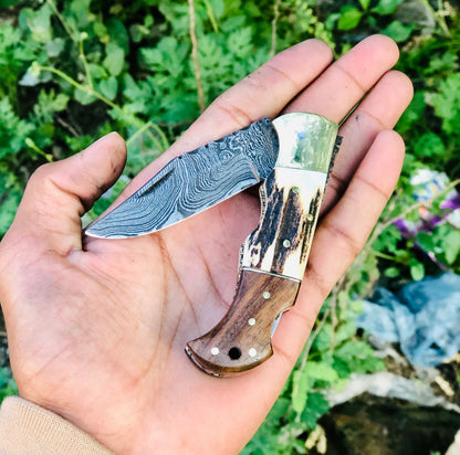 Custom Handmade Damascus Steel Folding Pocket Knife with Rosewood, Antler Horn, and Brass Bolster Handle and Leather Case